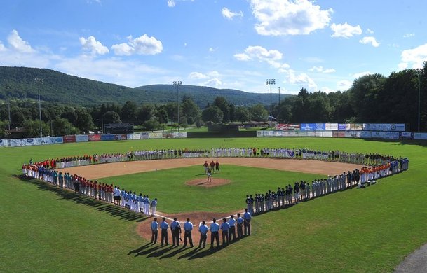 Teams lined up on the diamond at Cooperstown Baseball World